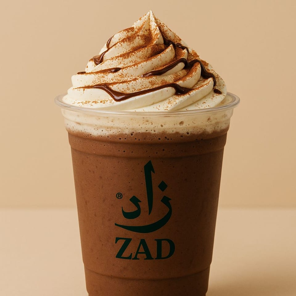 Zad's chocolate frappe with whipped cream, chocolate drizzle, and cinnamon powder.